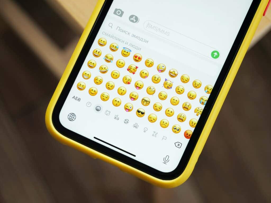 Smiling emojis and colorful stickers enhancing a social media post for higher engagement.